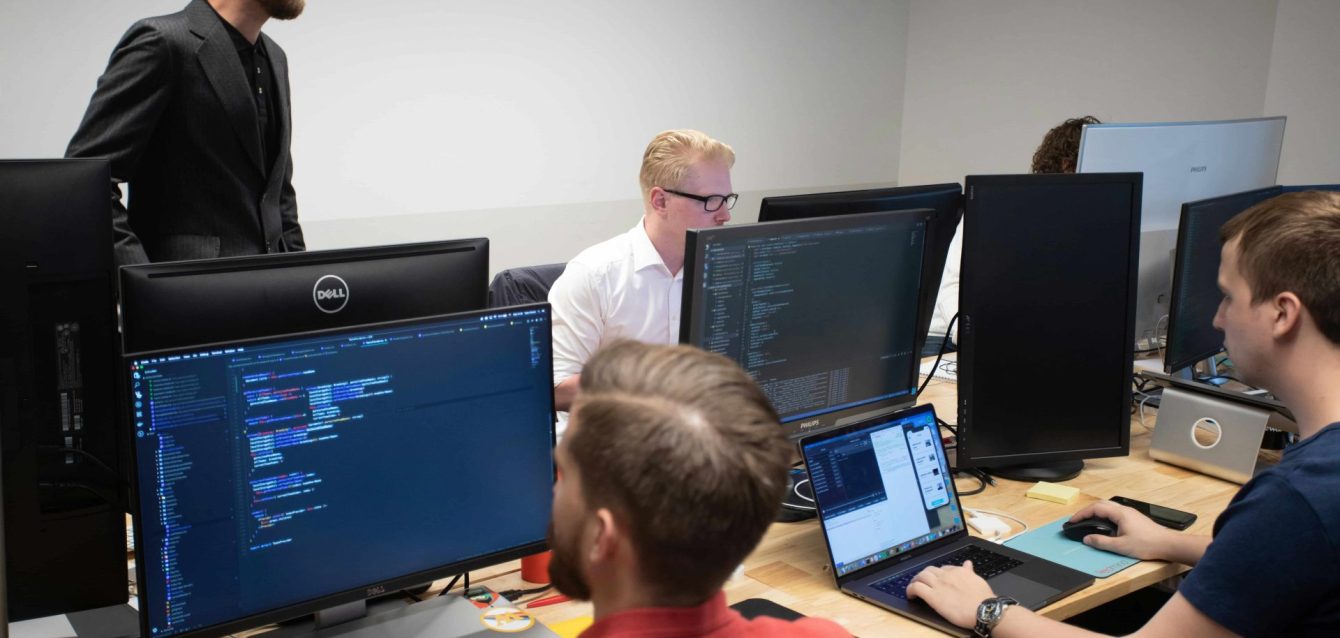 Business team in the USA collaborating on a custom software project with trust and transparency